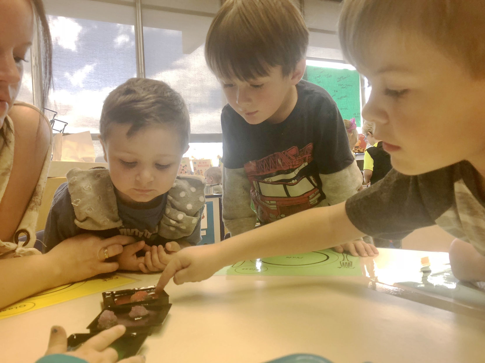 Head Start preschool students grow crystals during free choice time